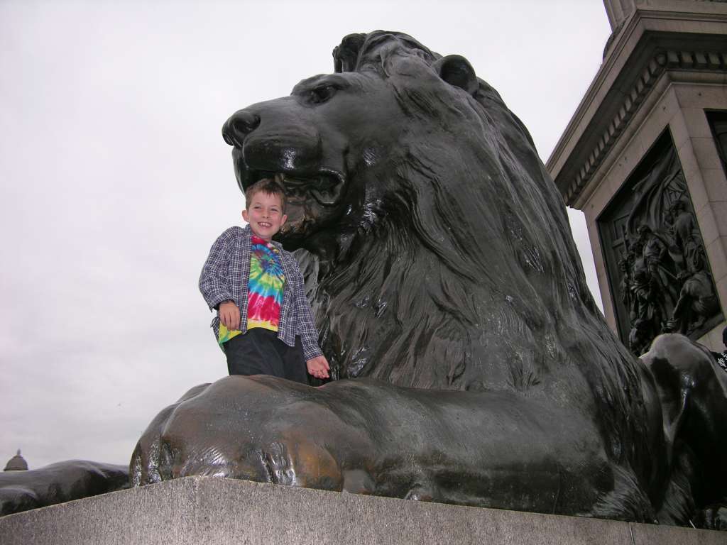 London National Gallery Top 20 00 Peter on Lion in Trafalger Square Here are my top 20 favourite paintings at the National Gallery in London, arranged in chronological sequence. The National Gallery is an art gallery in London, located on the north side of Trafalgar Square. The collection of 2,300 Western European paintings from 1250 to 1900 belongs to the British public, and entry to the main collection is free. Photography is not allowed. Peter needed some help to climb on the lion at Trafalgar Square.